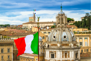 italian flag waving in front of church of santa maria di loreto